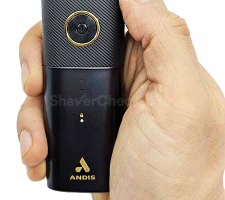 Activating the Andis reSURGE travel lock.