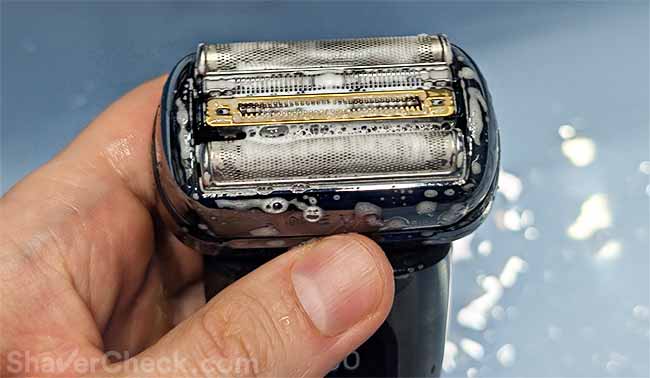 Cleaning the shaver with soap.